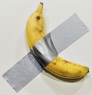 A banana duct-taped to a wall